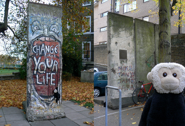 Mooch monkey at two portions of the Berlin Wall.