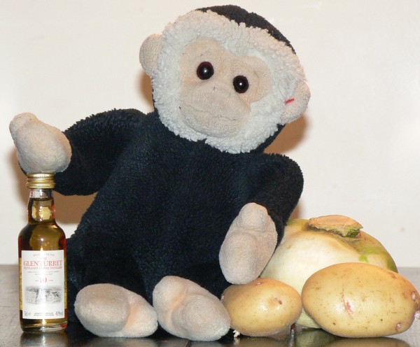Mooch monkey is ready for Burns night with his bottle of whisky, turnip and potatoes, but no haggis!