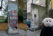 Mooch monkey at two sections of the Berlin Wall