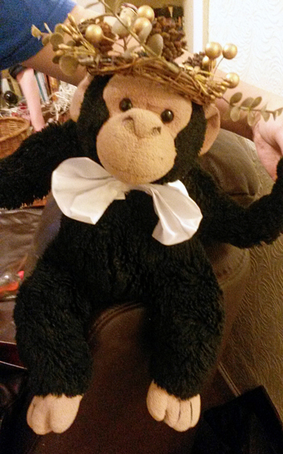 Ben the chimp at Christmas wearing a crown.