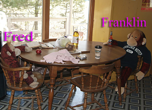 Two of Squirt's family sit at a table.