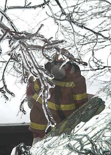 Squirt as fireman in ice storm.