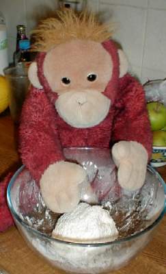 Big Mama Schweetheart makes the dough for her roly poly pudding in a bowl.