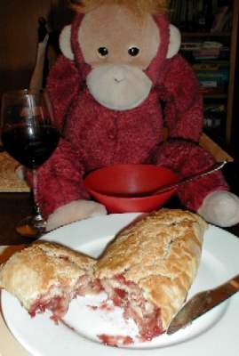 Mama shows off her jam roly-poly pudding.