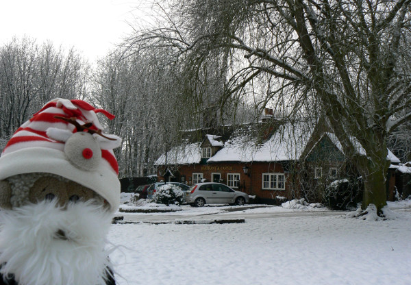 Mooch monkey in the snow outside the Elephant & Castle, Amwell, Wheathampstead, Hertfordshire.