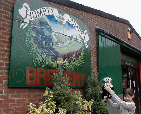 Annie holds the Mooch family up by the sign