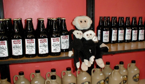 Mooch with his kids amongst beer bottles in the shop.