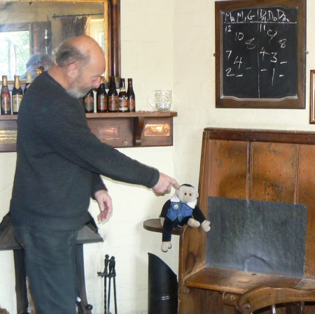 Mooch is shown the nurdling hole in the bench by the world champion
