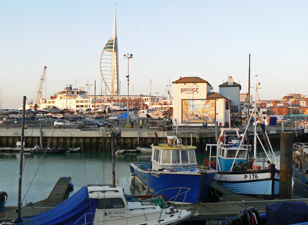 The Bridge Tavern, Portsmouth, with fishing boats in the harbour.