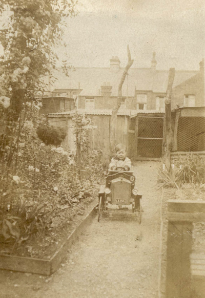Bob in his pedal car in the garden of 22 Lowestoft Road, Watford (c1924)