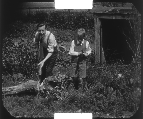 Bob and brother Dennis chopping wood on the Isle of Wight, c1938.