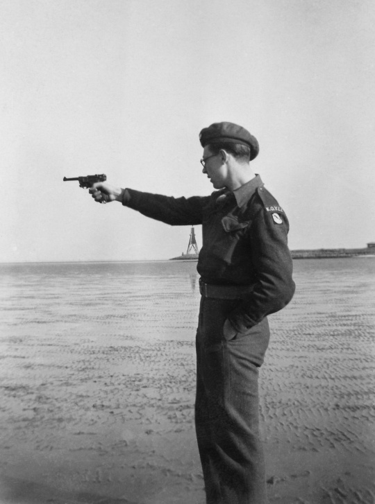Bob shooting his Luger on the beach. Cuxhaven 1946.