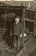 Me in my school uniform beside the chicken run