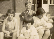 Joyce and Vera King, me and Joan Humphreys holding Dennis, 1930