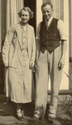 My Mum and Dad, c1934, by the French windows at 74 Bushey Mill Crescent.