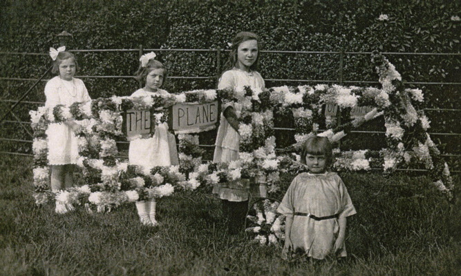 Edna and Eva with 'The Plane' at a churches and chapels gathering (c1919).