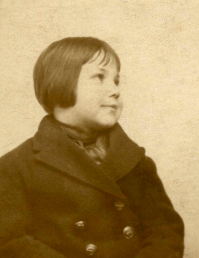 Una at 4 years old with short hair, in her reefer jacket which had brass buttons.