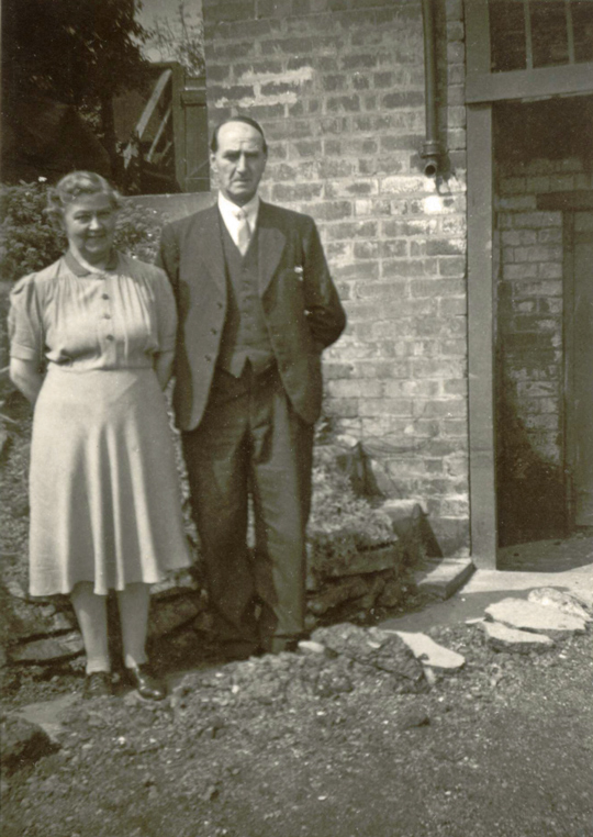Una's Mum and Dad at the rear of their house at 12 Roland Avenue in Nottingham, c1939.