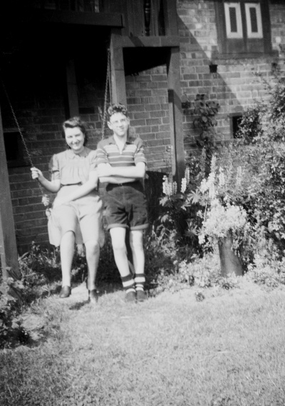 Una's cousins Eileen and Maurice on the swing in the back garden of 12 Roland Avenue, Wilford. 1941.