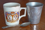 The mug and teaspoon from the Coronation of King George VI and the aluminium beaker from the Silver Jubilee