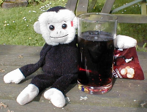 Moochie 1 drinks a Coke.