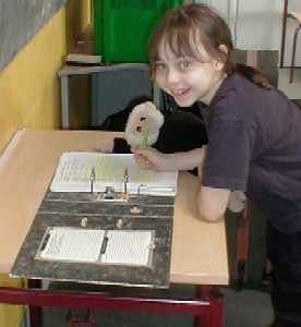 Mooch helps Annie sign out from school.