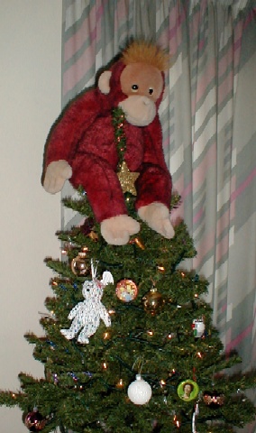 Big Mama Schweetheart tries to be the fairy at the top of the Christmas tree.