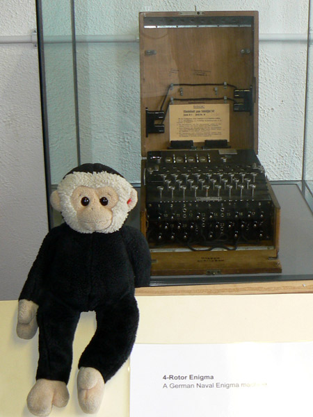 Mooch monkey with a German Naval four-rotor Enigma cipher machine.