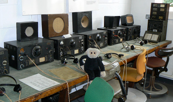 Mooch monkey with some of the WWII wireless radio equipment.