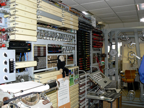 Mooch monkey sits on the rebuilt Colossus computer at Bletchley Park.