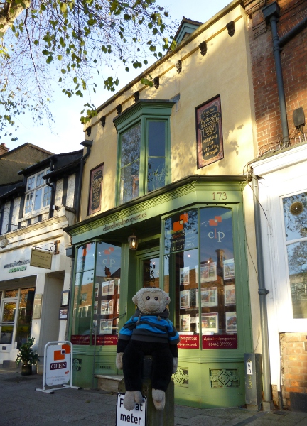 Mooch monkey outside the oldest shop in England.