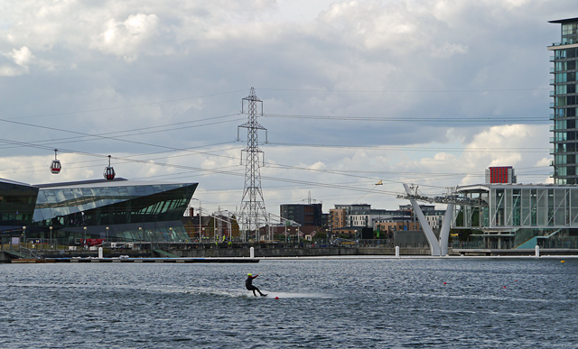 Mooch monkey uses the TfL Emirates Air Line cable car - seen across the Royal Victoria Dock