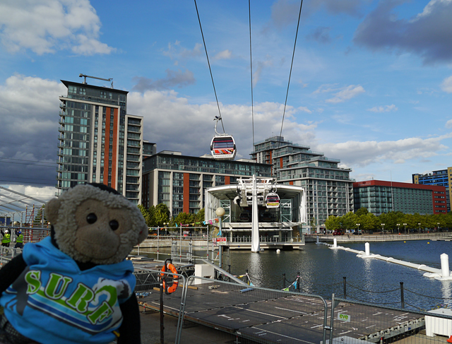 Mooch monkey uses the TfL Emirates Air Line cable car - Royal Docks terminal