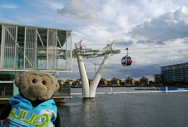 Mooch monkey uses the TfL Emirates Air Line cable car - cable car cabins at terminals