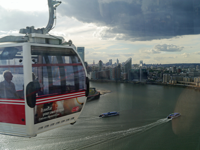 Mooch monkey uses the TfL Emirates Air Line cable car - looking west cable car cabin passing