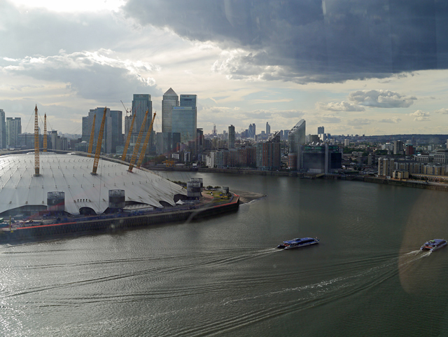 Mooch monkey uses the TfL Emirates Air Line cable car - looking west towards the O2 Dome, Docklands and the City of London