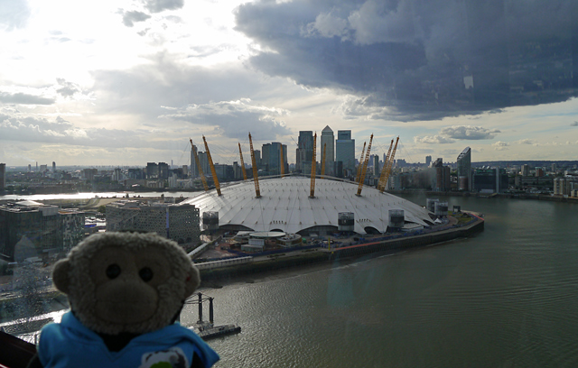 Mooch monkey uses the TfL Emirates Air Line cable car - looking west towards the O2 Dome, Docklands and the City of London