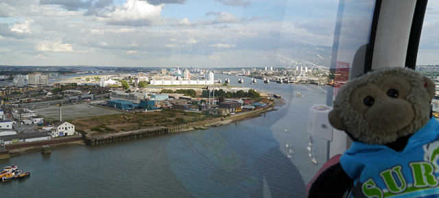 Mooch monkey uses the TfL Emirates Air Line cable car - looking east towards the Thames Barrier