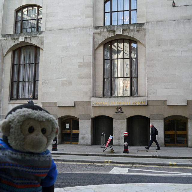 Mooch monkey outside the Old Bailey entrance