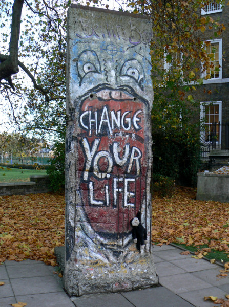 Mooch monkey on a section of the Berlin Wall at the Imperial War Museum in London.