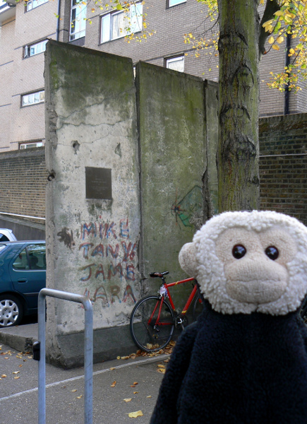 Mooch monkey on a section of the Berlin Wall at the National Army Museum in London.