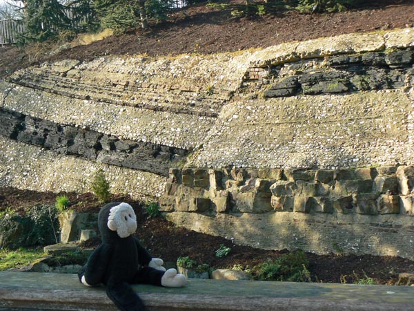 Mooch monkey beside the fake geological strata in Crystal Palace Park.