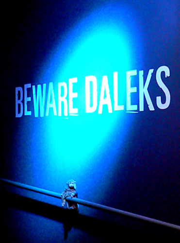 Bonsai under a Beware Daleks sign.