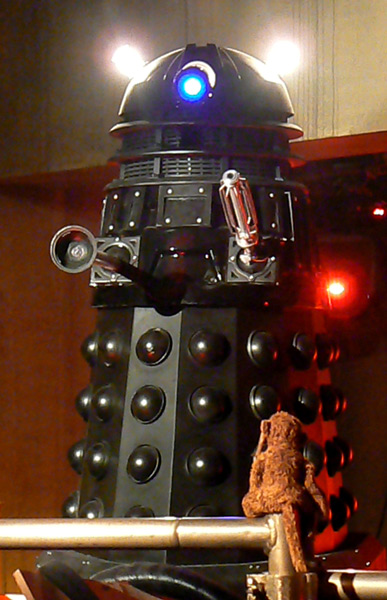 Bonsai talks to the black Dalek Sec from Doctor Who.