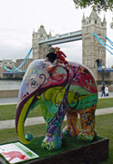 Mooch monkey meets a friend on an elephant at Tower Bridge during the Elephant Parade London 2010