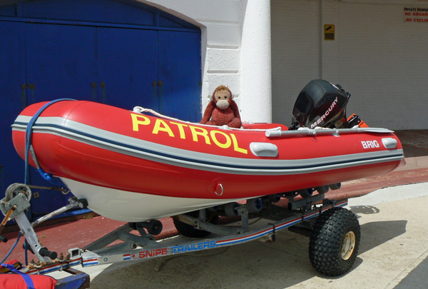 Big Mama sitting in a red patrol boat