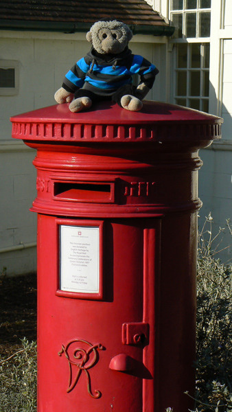 Mooch monkey on a post box at Osborne House.