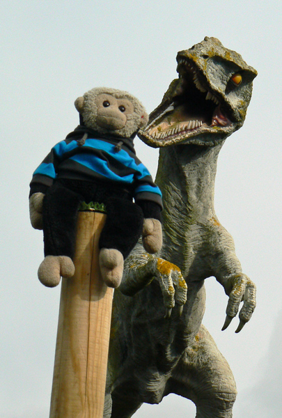 Mooch monkey with dinosaur at Amazon World.
