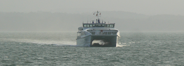 A catamaran ferry arrives at Portsmouth.