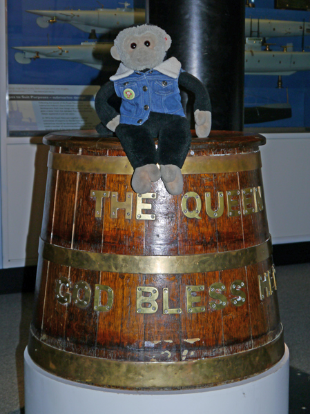 Mooch monkey at the Submarine Museum on rum barrel.
